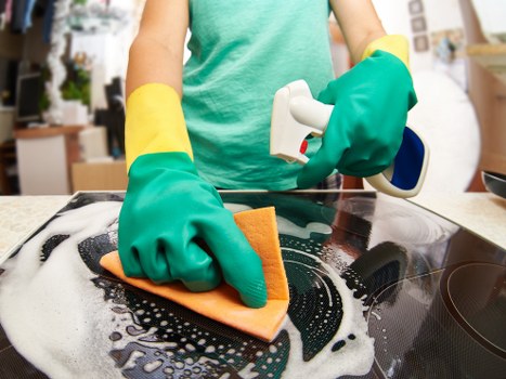 Deep cleaning bathroom fixtures during a move-out clean in Bow
