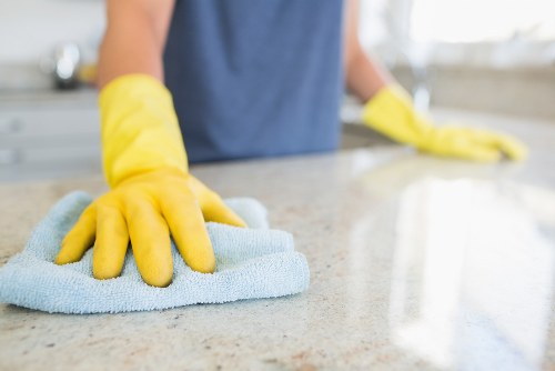 Local oven cleaner working in a Bow apartment kitchen